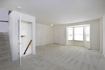 a bedroom with white walls at Carlson Woods Townhomes, Baltimore, MD, 21244